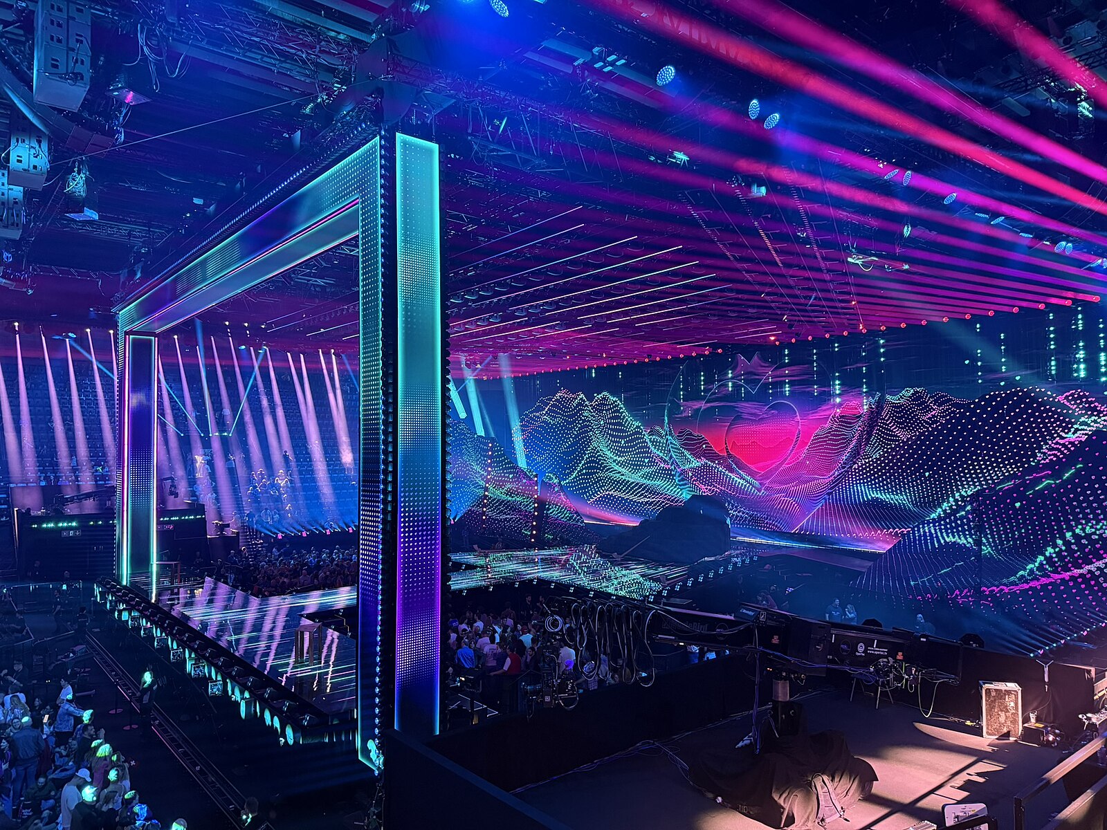 The Eurovision Song Contest 2025 stage in Basel, with LED mountains and a lit portal